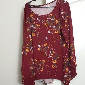 Long sleeve burgundy shirt with handkerchief hem.